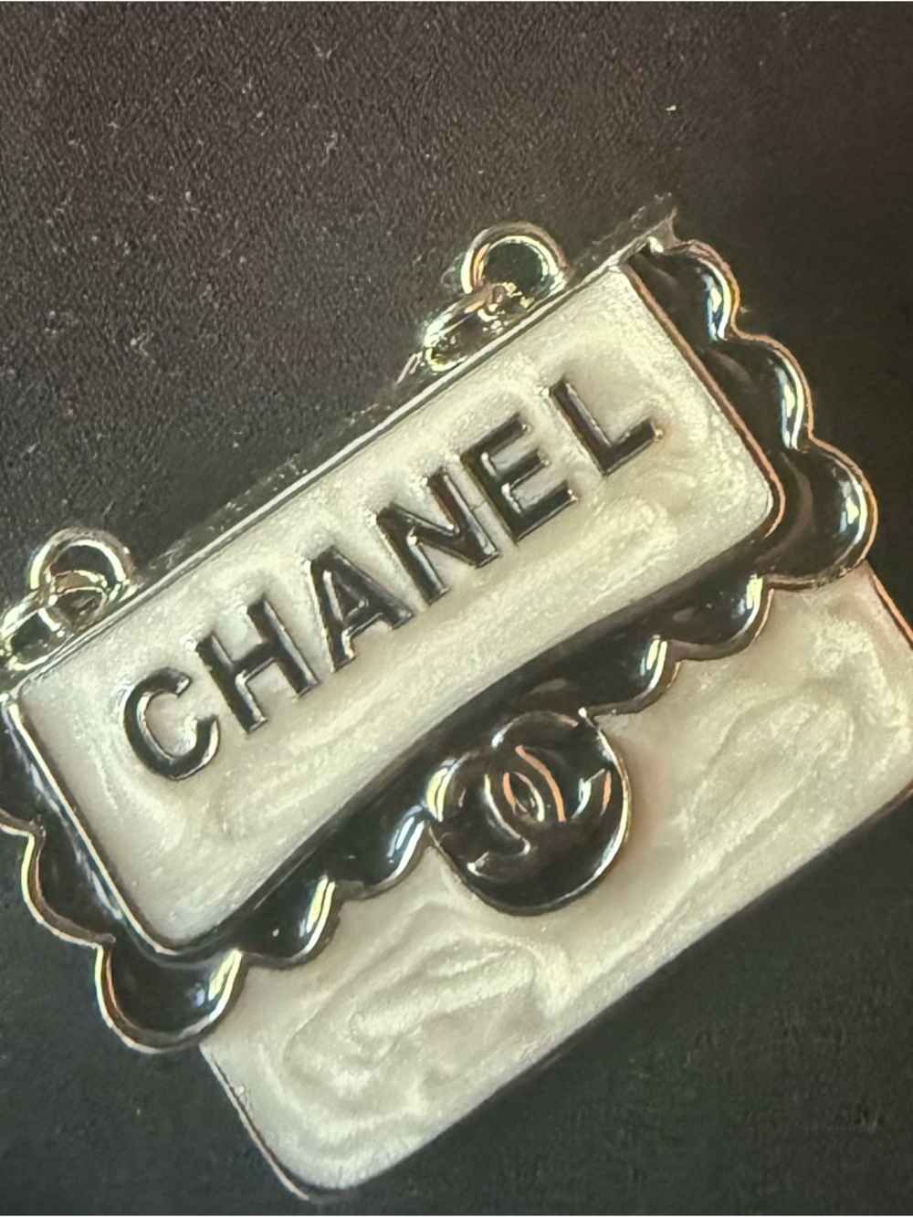 CHANEL White Enamel Logo Bag Charm with Silver-Tone Trim
